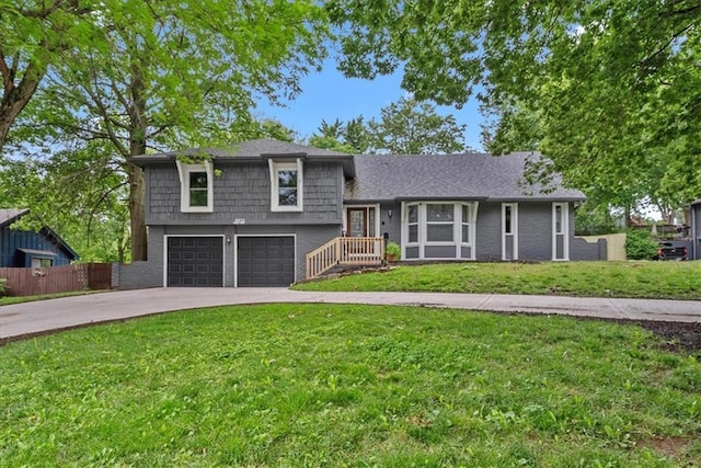 8932 Nall Ave, Overland Park, KS 66207 - tri-level home with concrete driveway and a garage