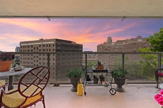 balcony at dusk with a city view