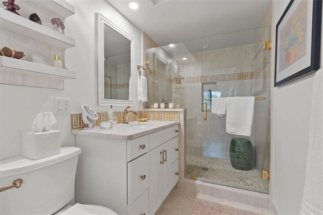 bathroom with toilet, a shower stall, vanity, recessed lighting, and tile patterned floors