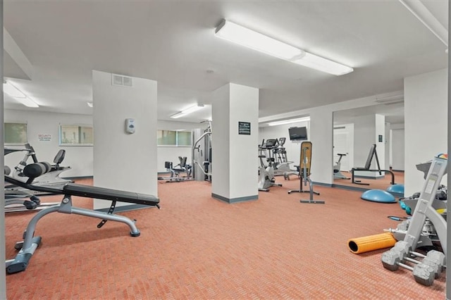 gym with carpet floors and baseboards