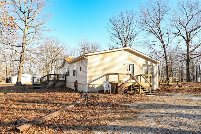 20662 Rb Hwy, Flemington, MO 65650 - view of side of property with a deck and crawl space