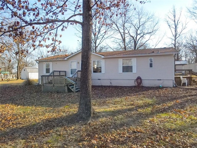 20662 Rb Hwy, Flemington, MO 65650 - rear view of property with an outbuilding, crawl space, a shed, and a wooden deck