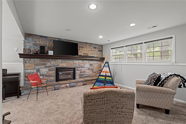 living room featuring carpet, a fireplace, baseboards, and recessed lighting