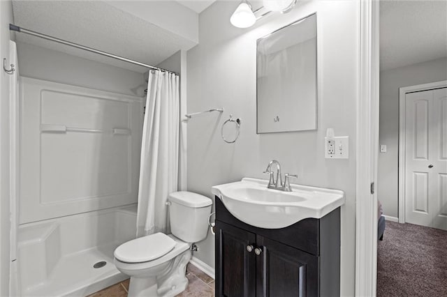 full bath with curtained shower, baseboards, vanity, toilet, and a textured ceiling