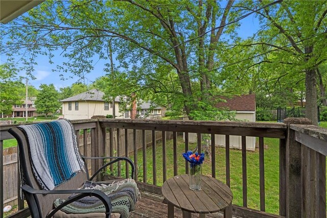 wooden deck with a lawn
