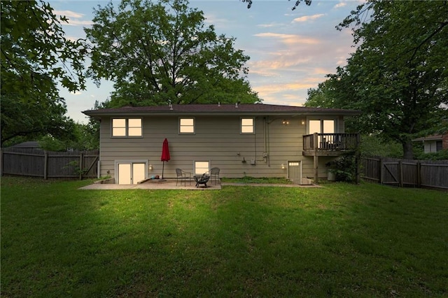 rear view of property featuring a patio area
