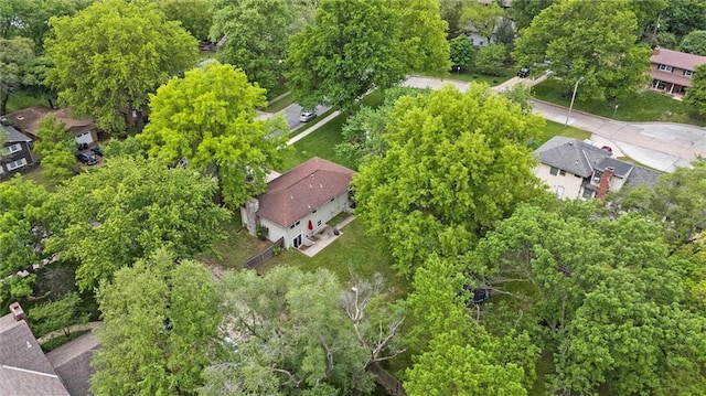 aerial view of property and surrounding area featuring nearby suburban area