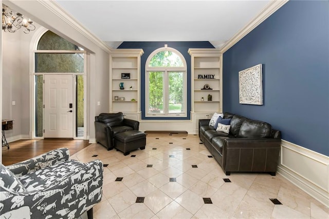 12843 Noland St, Overland Park, KS 66213 - living room with built in shelves, ornamental molding, and a chandelier