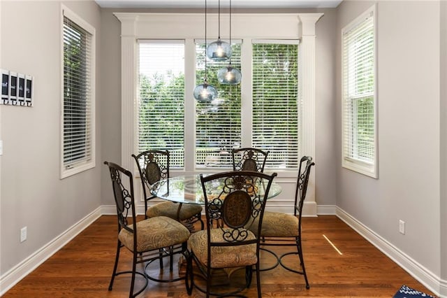 12843 Noland St, Overland Park, KS 66213 - dining space with dark wood finished floors and plenty of natural light