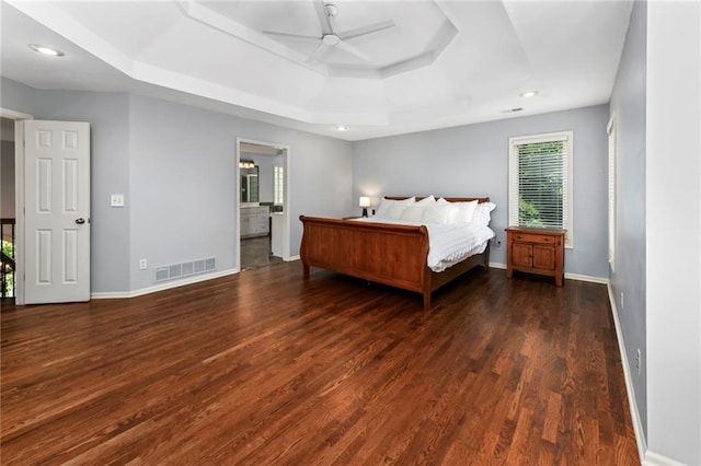 12843 Noland St, Overland Park, KS 66213 - bedroom featuring a tray ceiling, wood finished floors, recessed lighting, ceiling fan, and connected bathroom