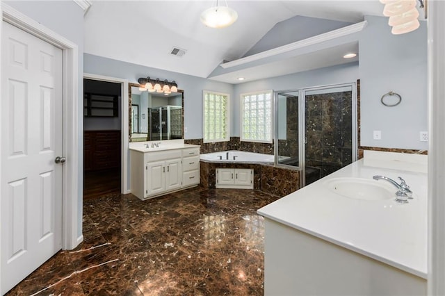 12843 Noland St, Overland Park, KS 66213 - bathroom with marble tiled flooring, two vanities, a bath, a stall shower, and lofted ceiling