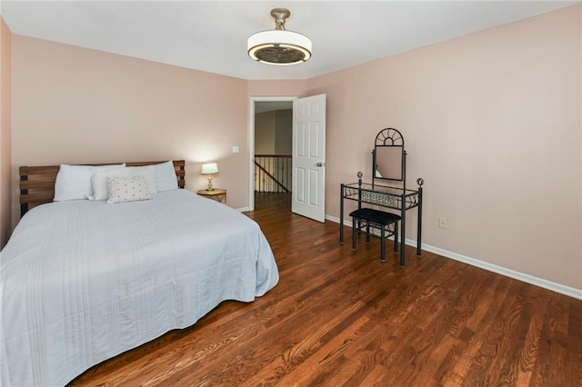 12843 Noland St, Overland Park, KS 66213 - bedroom with baseboards and wood finished floors