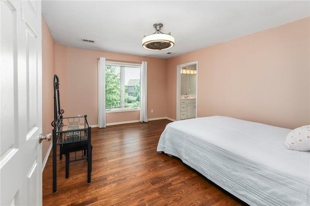 12843 Noland St, Overland Park, KS 66213 - bedroom with dark wood-style flooring and baseboards