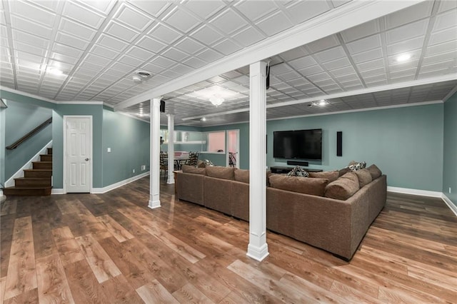 12843 Noland St, Overland Park, KS 66213 - living room with ornate columns, stairway, and wood finished floors