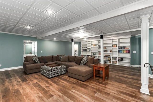 12843 Noland St, Overland Park, KS 66213 - living room with wood finished floors, built in features, ornate columns, and recessed lighting