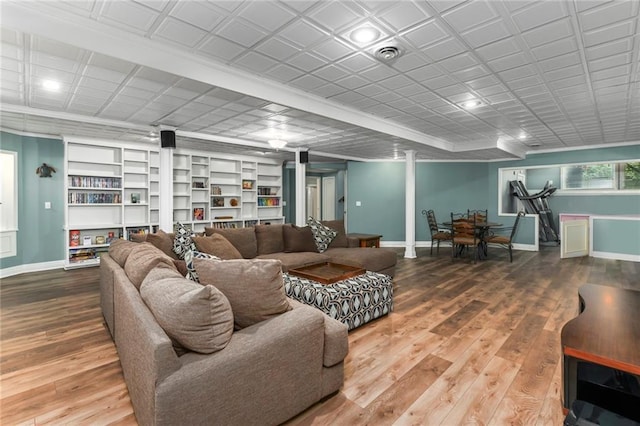12843 Noland St, Overland Park, KS 66213 - living room featuring wood finished floors and built in shelves