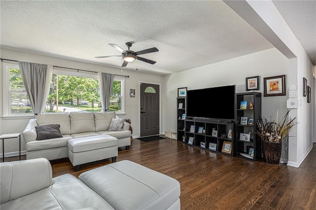 6405 Haskell Ave, Kansas City, KS 66104 - living area featuring a textured ceiling, ceiling fan, wood finished floors, and baseboards