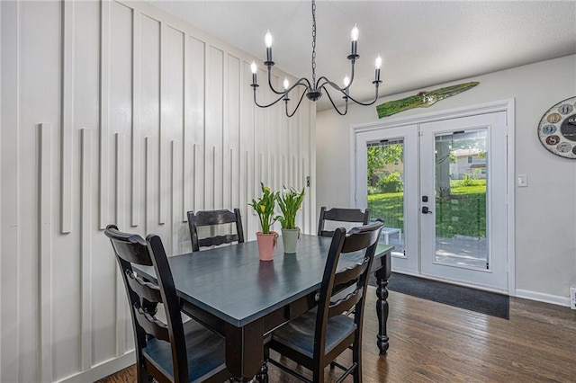 6405 Haskell Ave, Kansas City, KS 66104 - dining room with a chandelier, dark wood-type flooring, baseboards, and french doors