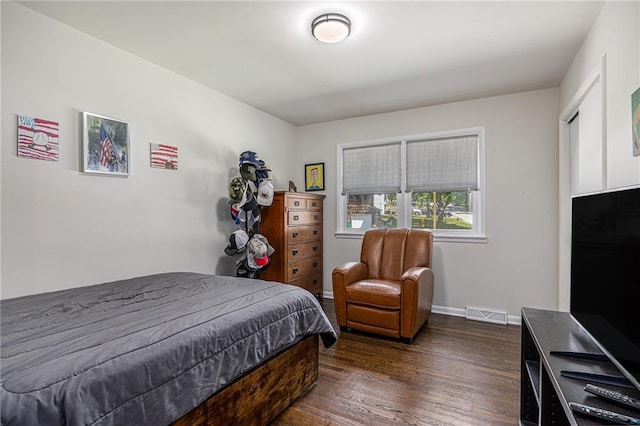 6405 Haskell Ave, Kansas City, KS 66104 - bedroom featuring dark wood-style floors and baseboards