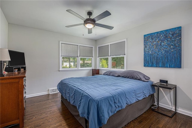 6405 Haskell Ave, Kansas City, KS 66104 - bedroom featuring wood finished floors, baseboards, and ceiling fan