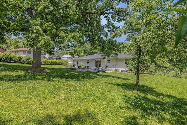 6405 Haskell Ave, Kansas City, KS 66104 - view of grassy yard with a patio