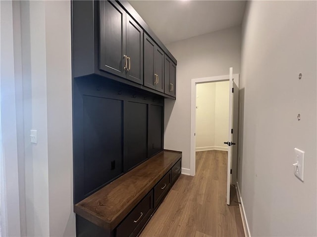 mudroom with light wood-type flooring and baseboards