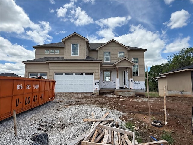 18456 Pawnee Ln, Overland Park, KS 66085 - view of front of home with gravel driveway and a porch