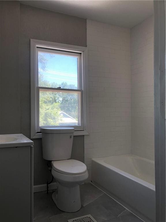 2063 Springfield Blvd, Kansas City, KS 66101 - bathroom with tile patterned floors, toilet, and vanity