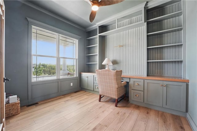 11588 S Houston St, Olathe, KS 66061 - office area featuring ceiling fan, light wood-style floors, built in shelves, and ornamental molding