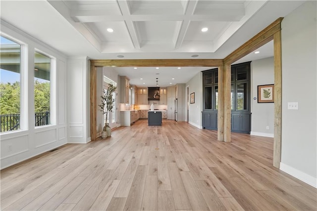 11588 S Houston St, Olathe, KS 66061 - unfurnished living room with healthy amount of natural light, beam ceiling, light wood-style flooring, coffered ceiling, and recessed lighting