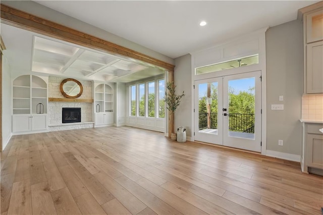 11588 S Houston St, Olathe, KS 66061 - unfurnished living room featuring french doors, light wood-type flooring, beamed ceiling, recessed lighting, and baseboards