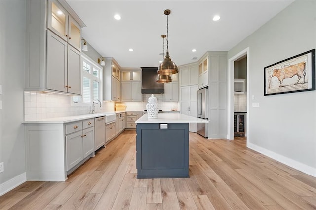 11588 S Houston St, Olathe, KS 66061 - kitchen with high end fridge, dishwasher, a center island, light wood-style flooring, and recessed lighting