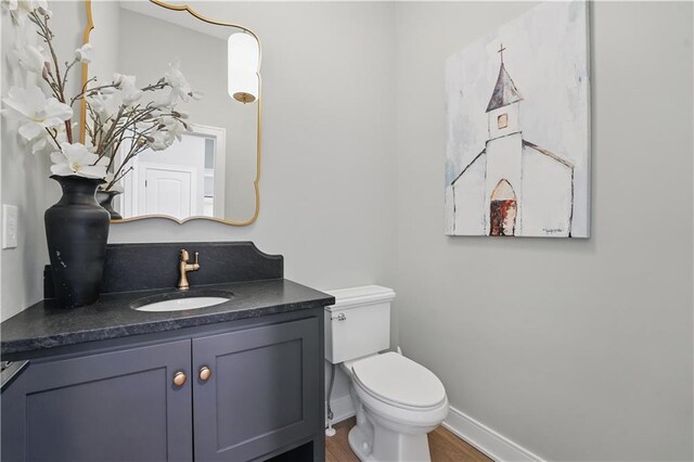 11588 S Houston St, Olathe, KS 66061 - bathroom with vanity, toilet, wood finished floors, and baseboards