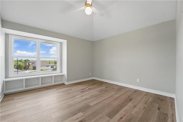 11588 S Houston St, Olathe, KS 66061 - unfurnished room with wood finished floors, vaulted ceiling, baseboards, and ceiling fan