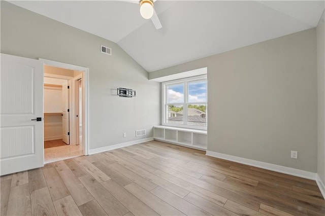 11588 S Houston St, Olathe, KS 66061 - empty room featuring lofted ceiling, ceiling fan, wood finished floors, and baseboards