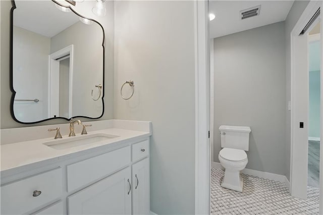 11588 S Houston St, Olathe, KS 66061 - bathroom with vanity, toilet, and baseboards