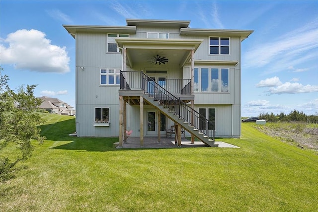 11588 S Houston St, Olathe, KS 66061 - back of property with stairs, ceiling fan, a patio, a wooden deck, and a yard