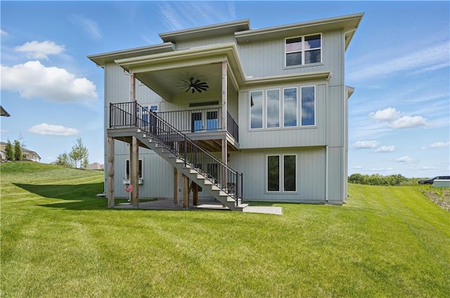 11588 S Houston St, Olathe, KS 66061 - back of house featuring stairway, a ceiling fan, a yard, and a deck