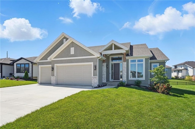 24765 W 89th Ter, Lenexa, KS 66227 - view of front facade featuring a front yard, an attached garage, concrete driveway, stone siding, and stucco siding