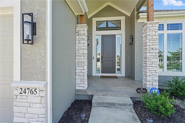 24765 W 89th Ter, Lenexa, KS 66227 - doorway to property with stucco siding