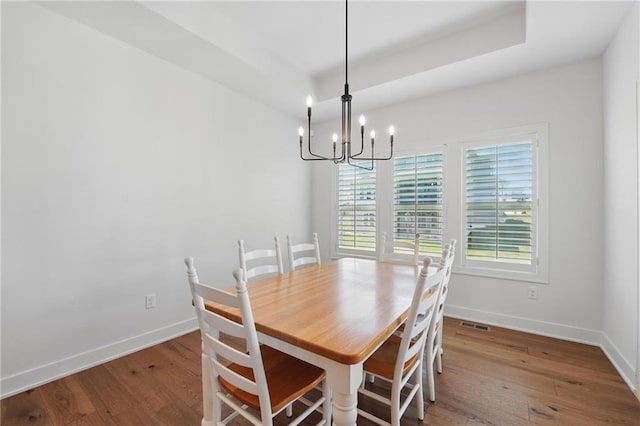 24765 W 89th Ter, Lenexa, KS 66227 - dining space featuring a chandelier, hardwood / wood-style floors, and baseboards
