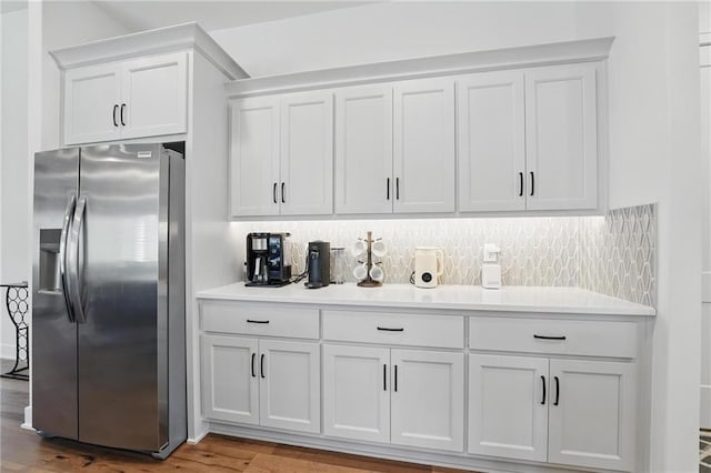 24765 W 89th Ter, Lenexa, KS 66227 - kitchen featuring stainless steel refrigerator with ice dispenser, light countertops, white cabinets, and wood finished floors