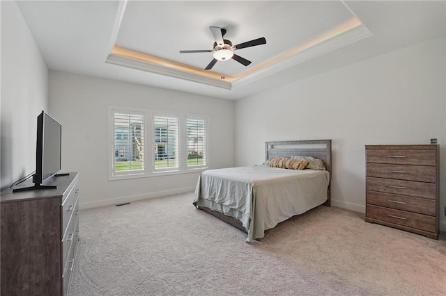 24765 W 89th Ter, Lenexa, KS 66227 - bedroom featuring a raised ceiling, light colored carpet, baseboards, and ceiling fan