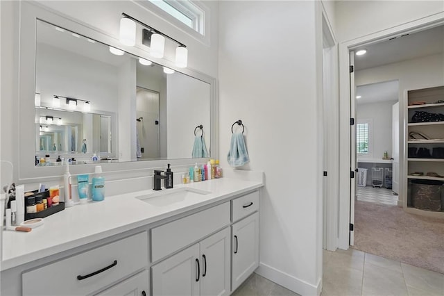 24765 W 89th Ter, Lenexa, KS 66227 - full bath with vanity, tile patterned floors, healthy amount of natural light, and a shower