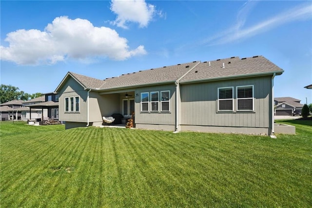 24765 W 89th Ter, Lenexa, KS 66227 - back of house with a ceiling fan, a lawn, and a patio area