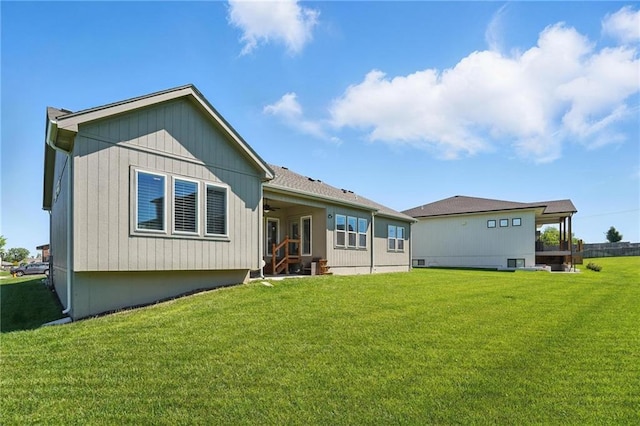 24765 W 89th Ter, Lenexa, KS 66227 - back of house featuring ceiling fan and a lawn