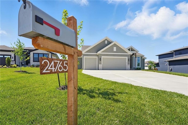 24765 W 89th Ter, Lenexa, KS 66227 - view of front of house featuring a garage, a front lawn, driveway, and stucco siding