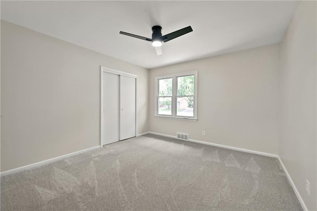 11524 Sunnyslope Dr, Kansas City, MO 64134 - unfurnished bedroom featuring carpet flooring, baseboards, a closet, and ceiling fan