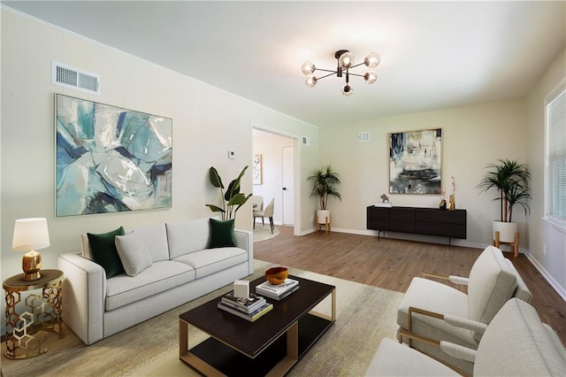 11524 Sunnyslope Dr, Kansas City, MO 64134 - living area featuring a chandelier and wood finished floors
