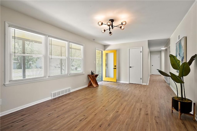 11524 Sunnyslope Dr, Kansas City, MO 64134 - spare room featuring wood finished floors and baseboards